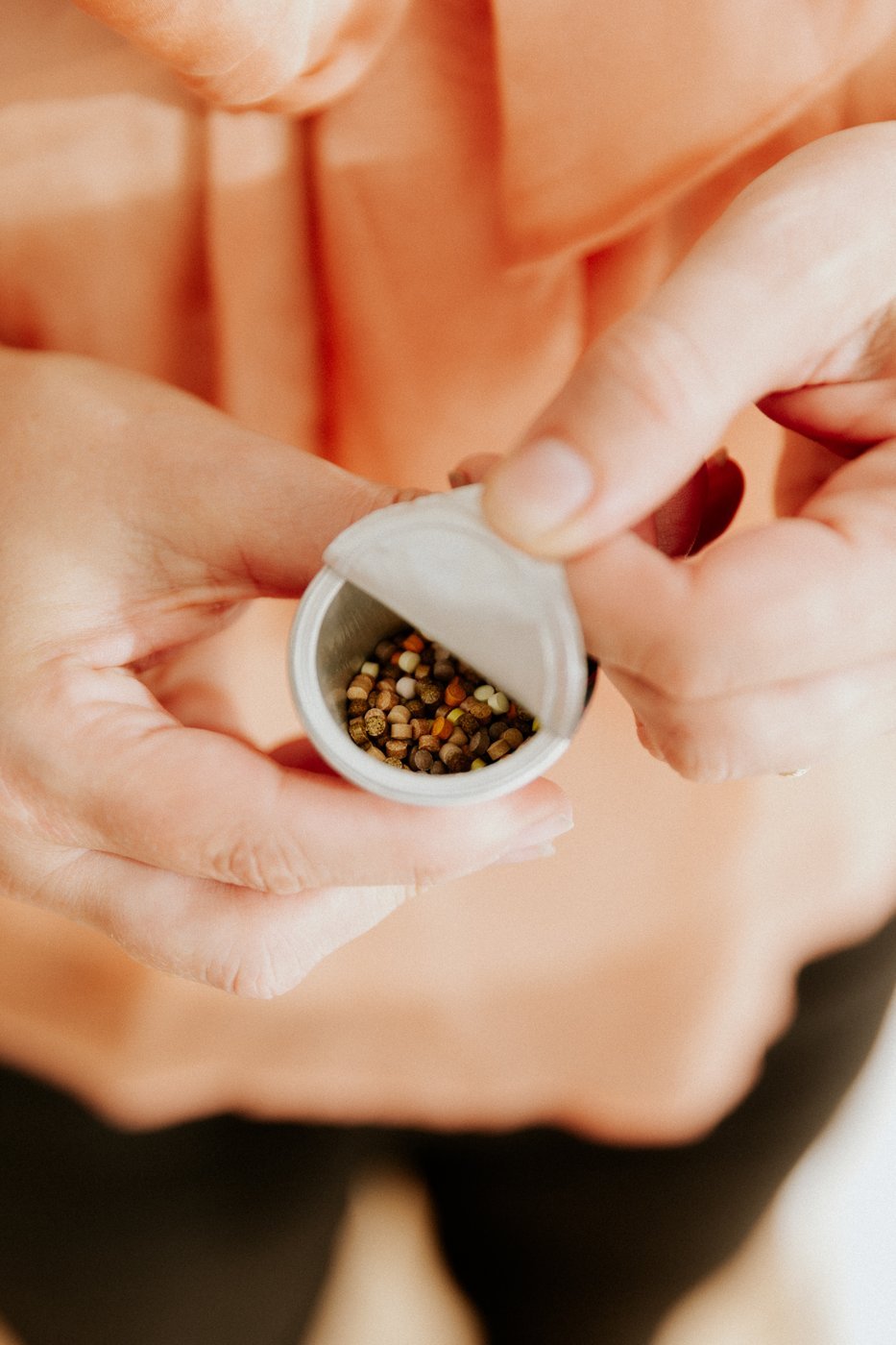 An open Bio Precision pod full of granules